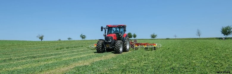 Case IH Vestrum tractor working in a green field